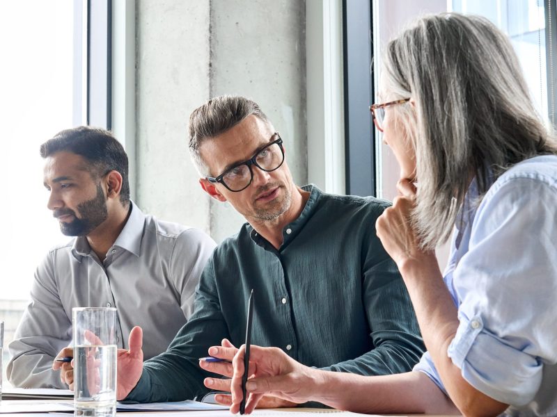 Team of men and women in a meeting
