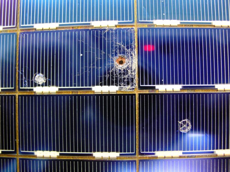 Holes in ESA built solar cells retrieved from the Hubble Space Telescope in 2002 caused by micrometeoroids