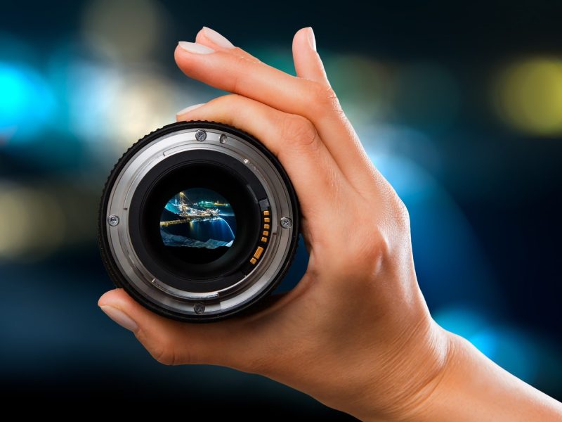 hand holding camera lens