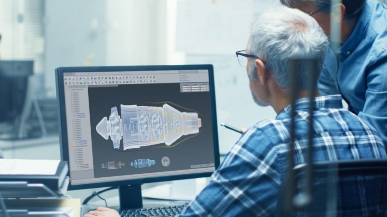 Man looking at graphic of engine on a screen