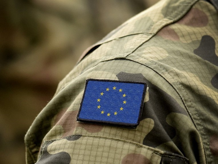 shoulder of person wearing military uniform with EU arm badge