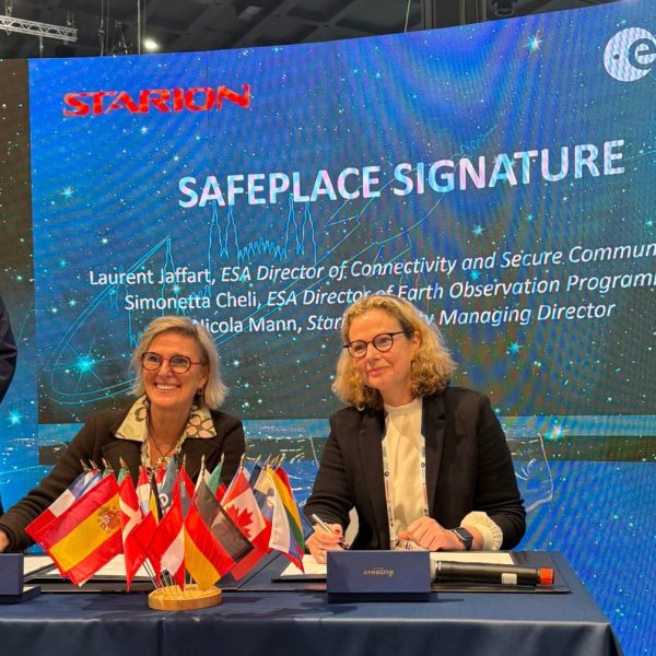 Signature event for the SAFEPLACE project at IAC2024 with two representatives from ESA and Starion at a desk and an ESA representative standing to one side.