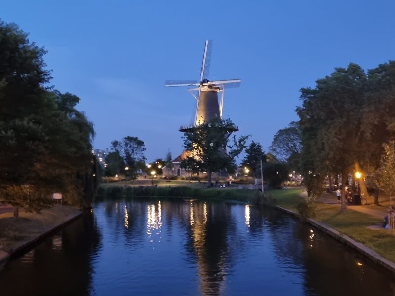 View of windmill and canal in Leiden, Netherlands
